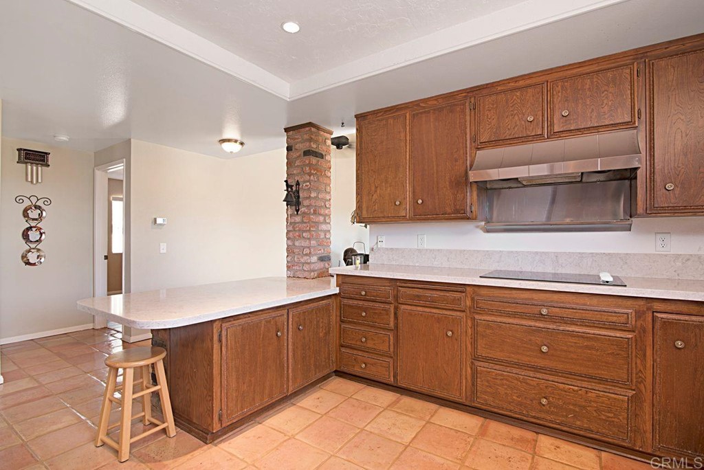 29573 Miller Road Valley Center, CA 92082 - Photo 14 of 37 a kitchen with cabinets and appliances
