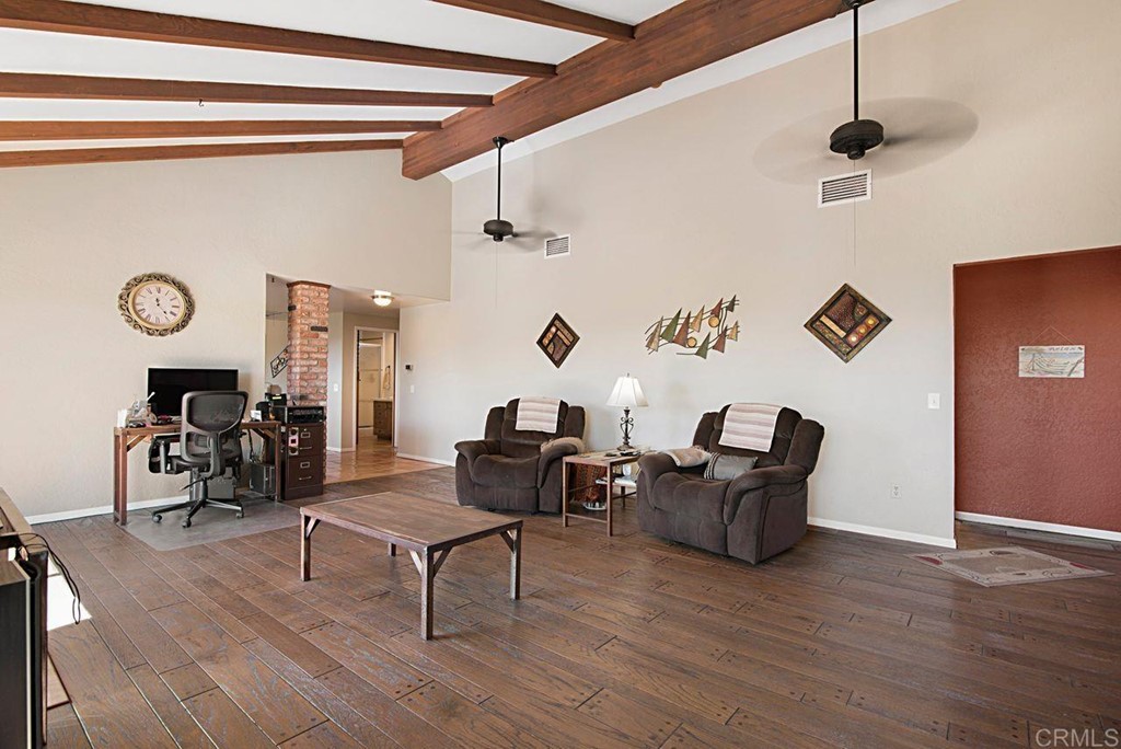 29573 Miller Road Valley Center, CA 92082 - Photo 16 of 37 a living room with furniture and wooden floor