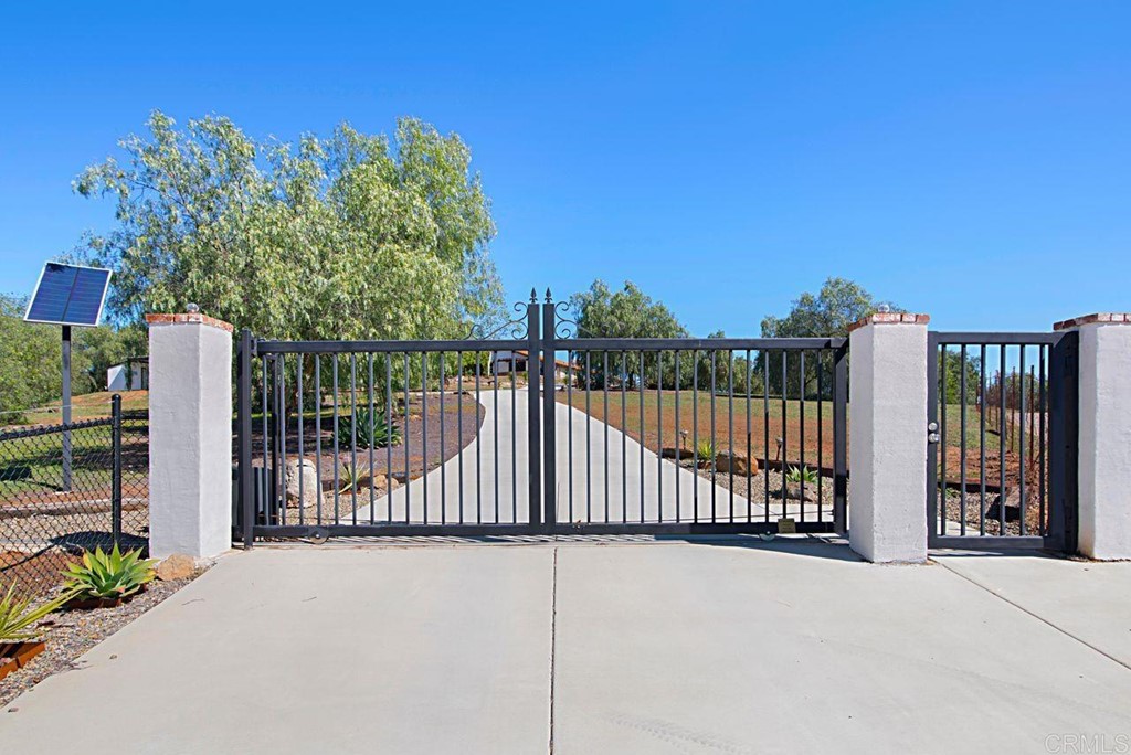 29573 Miller Road Valley Center, CA 92082 - Photo 2 of 37 a view of a wrought iron fences in front of house