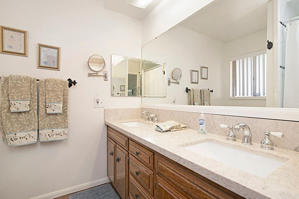 29573 Miller Road Valley Center, CA 92082 - Photo 24 of 37 a bathroom with a sink and a mirror