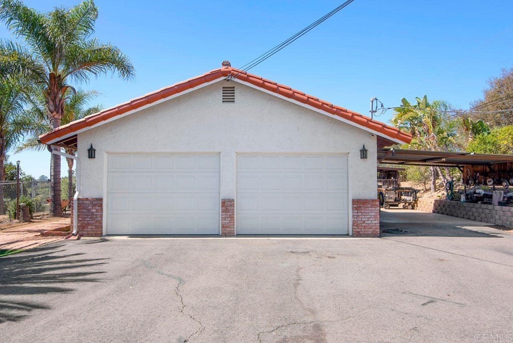 29573 Miller Road Valley Center, CA 92082 - Photo 26 of 37 a view of a house with a yard