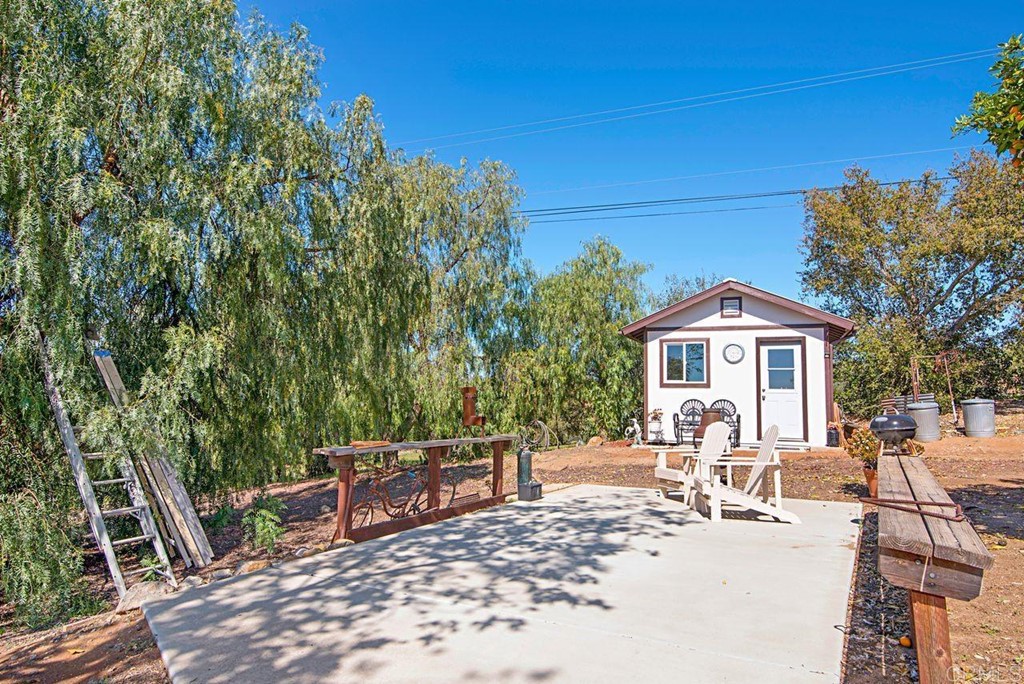 29573 Miller Road Valley Center, CA 92082 - Photo 33 of 37 a view of a chairs and table in backyard