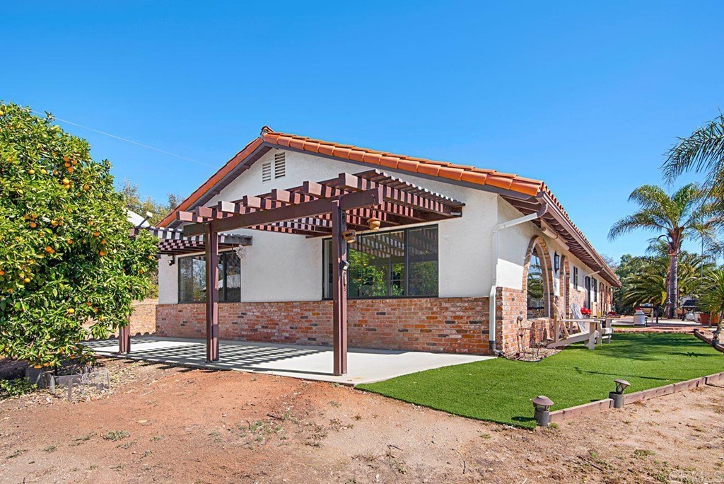29573 Miller Road Valley Center, CA 92082 - Photo 4 of 37 a view of a house with a yard