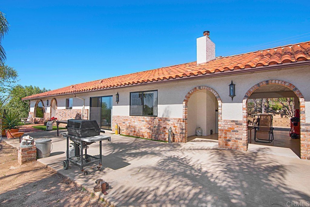 29573 Miller Road Valley Center, CA 92082 - Photo 5 of 37 a front view of a house with yard and seating area