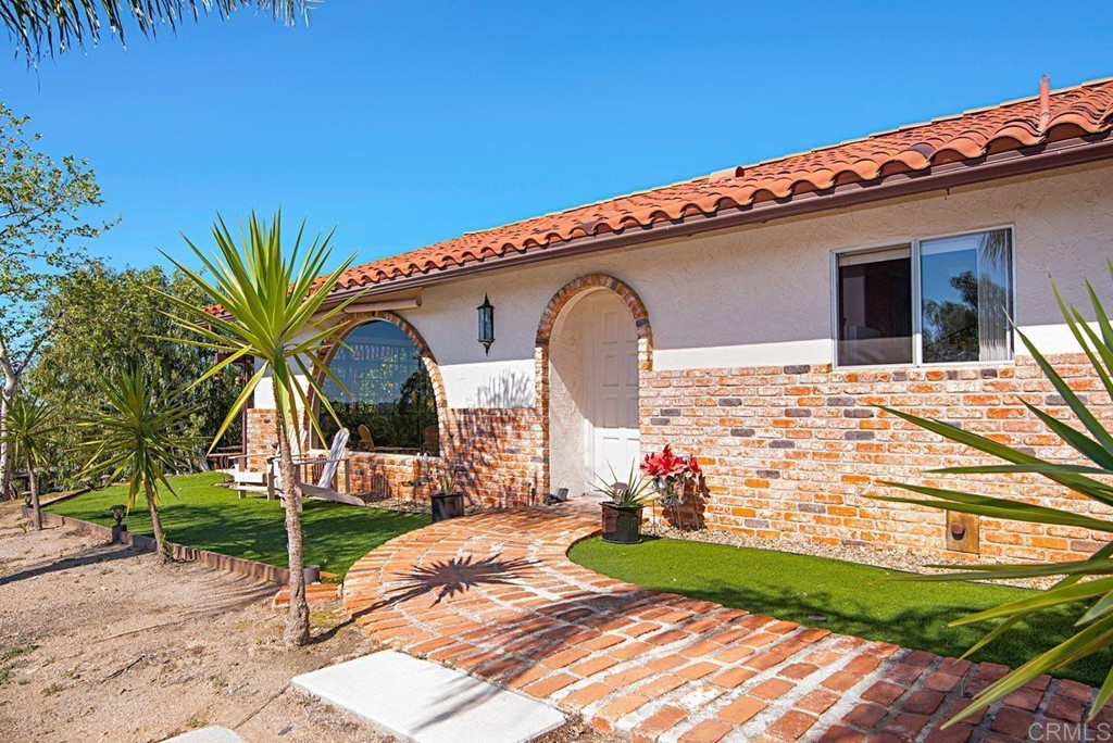 29573 Miller Road Valley Center, CA 92082 - Photo 6 of 37 a view of house with outdoor space and swimming pool
