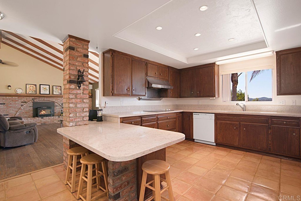 29573 Miller Road Valley Center, CA 92082 - Photo 10 of 37 a kitchen with a cabinets appliances and a counter