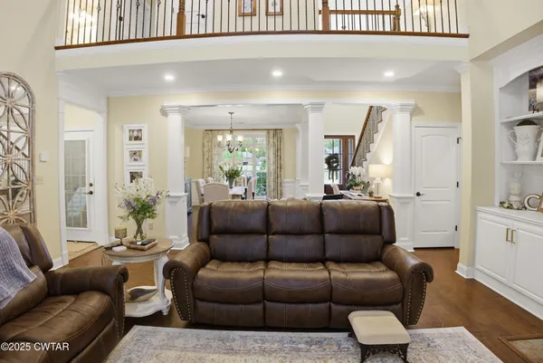 a view of a livingroom with furniture and a table