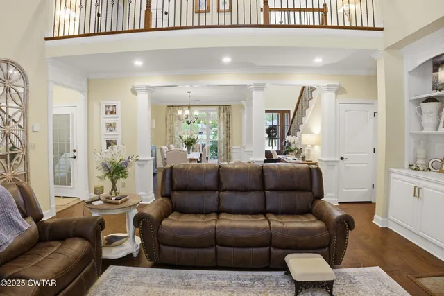 a view of a livingroom with furniture and a table