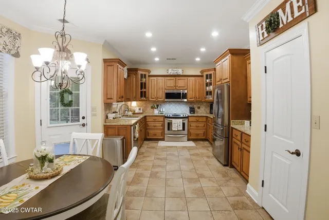a dining room with furniture window and wooden floor