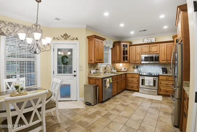 a bathroom with a tub a sink and a window