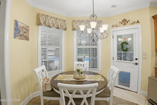 a bathroom with a granite countertop tub sink and mirror