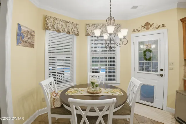 a bathroom with a granite countertop tub sink and mirror