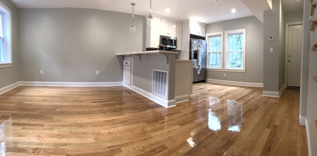 6 St James Place, Unit 6 Boston, MA 02119 - Photo 1 of 18 a view of a kitchen with a sink and cabinets