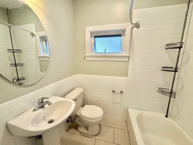 6 St James Place, Unit 6 Boston, MA 02119 - Photo 12 of 18 a bathroom with a sink a toilet and shower