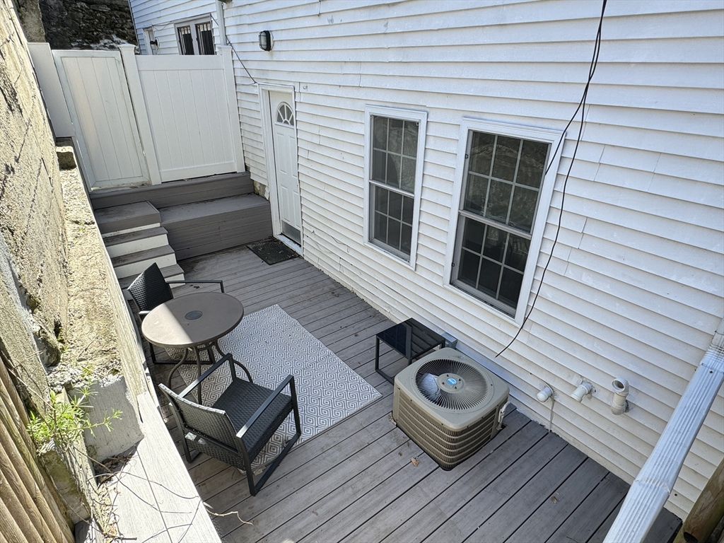 6 St James Place, Unit 6 Boston, MA 02119 - Photo 16 of 18 a view of deck with patio