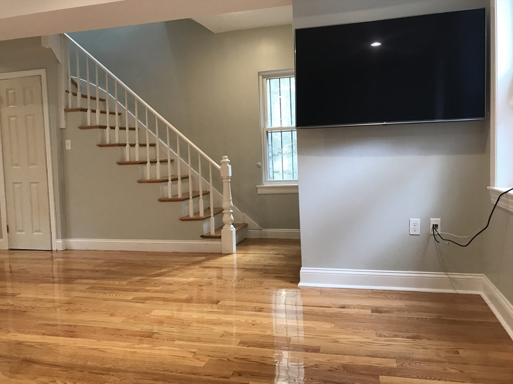 6 St James Place, Unit 6 Boston, MA 02119 - Photo 4 of 18 a view of entryway and hall with wooden floor