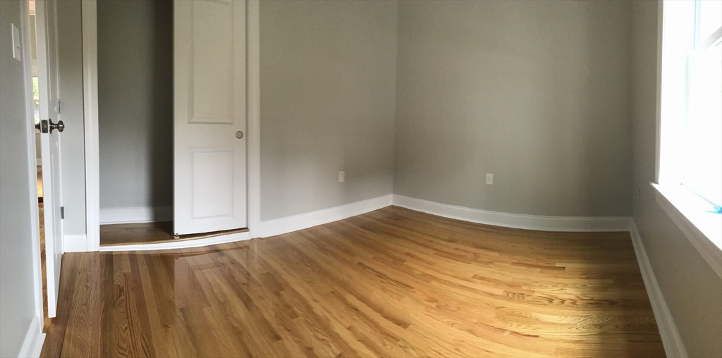 6 St James Place, Unit 6 Boston, MA 02119 - Photo 9 of 18 a view of an empty room and window