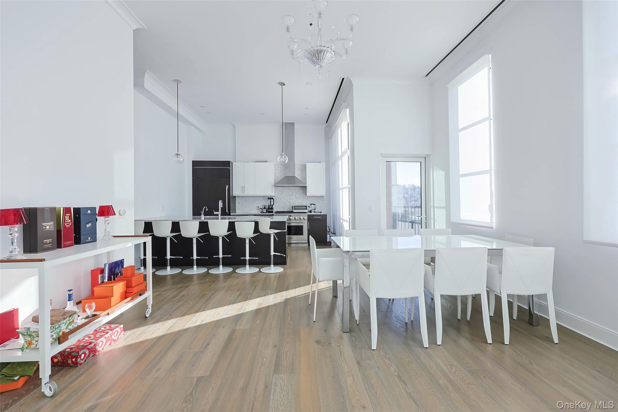 100 Garvies Point Road, Unit 1024 Glen Cove, NY 11542 - Photo 23 of 41 a living room with furniture and a wooden floor