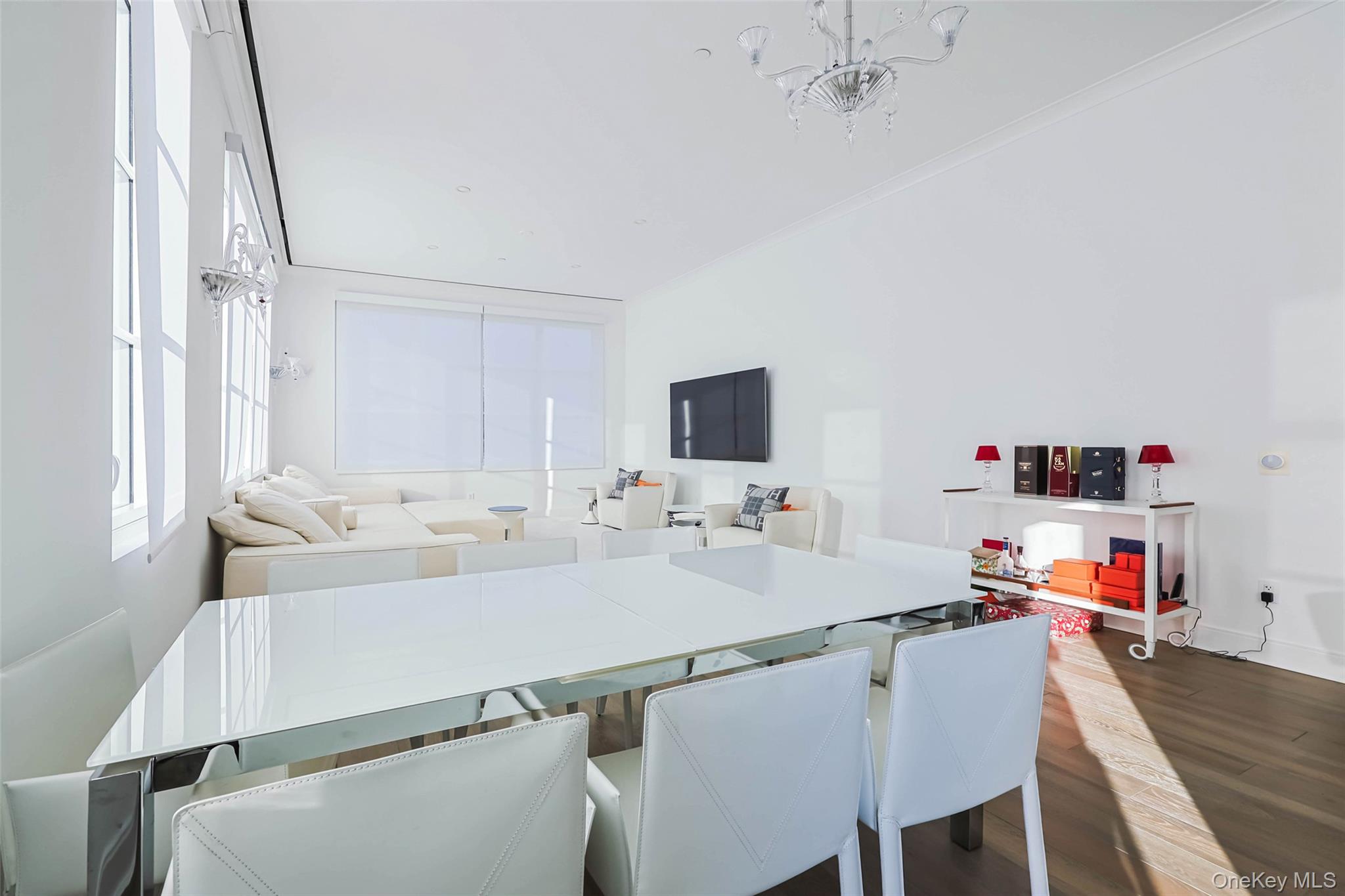 100 Garvies Point Road, Unit 1024 Glen Cove, NY 11542 - Photo 28 of 41 a room with a table and a couch