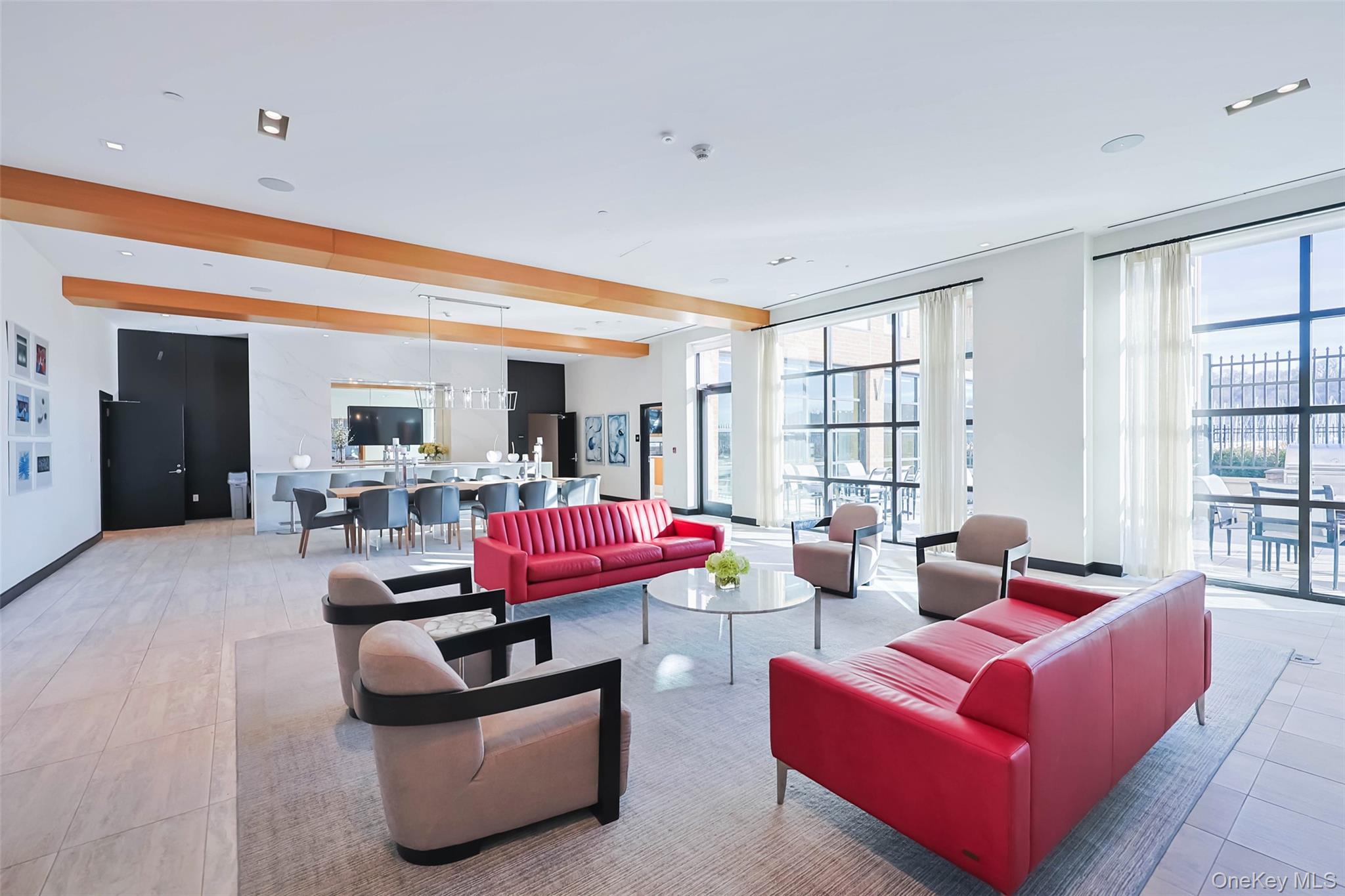 100 Garvies Point Road, Unit 1024 Glen Cove, NY 11542 - Photo 3 of 41 a living room with furniture and a large window