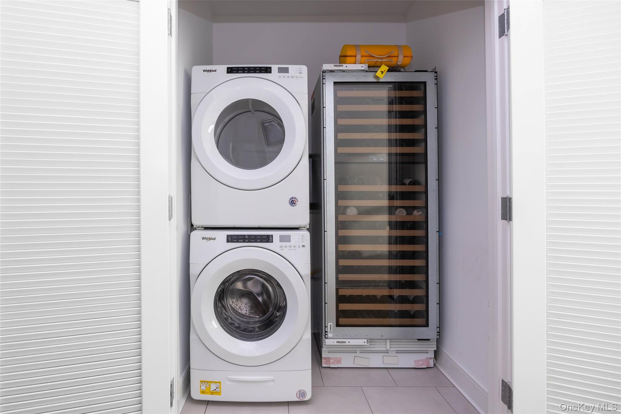 100 Garvies Point Road, Unit 1024 Glen Cove, NY 11542 - Photo 31 of 41 a close up view of a washer and dryer in a utility room