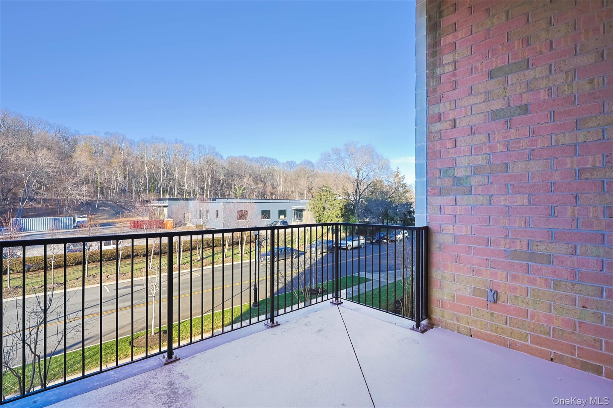 100 Garvies Point Road, Unit 1024 Glen Cove, NY 11542 - Photo 37 of 41 a view of a balcony with wooden fence