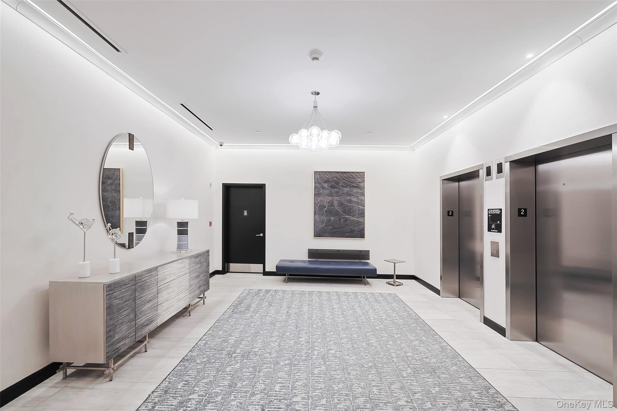 100 Garvies Point Road, Unit 1024 Glen Cove, NY 11542 - Photo 7 of 41 a view of a bathroom with sink shower and mirror