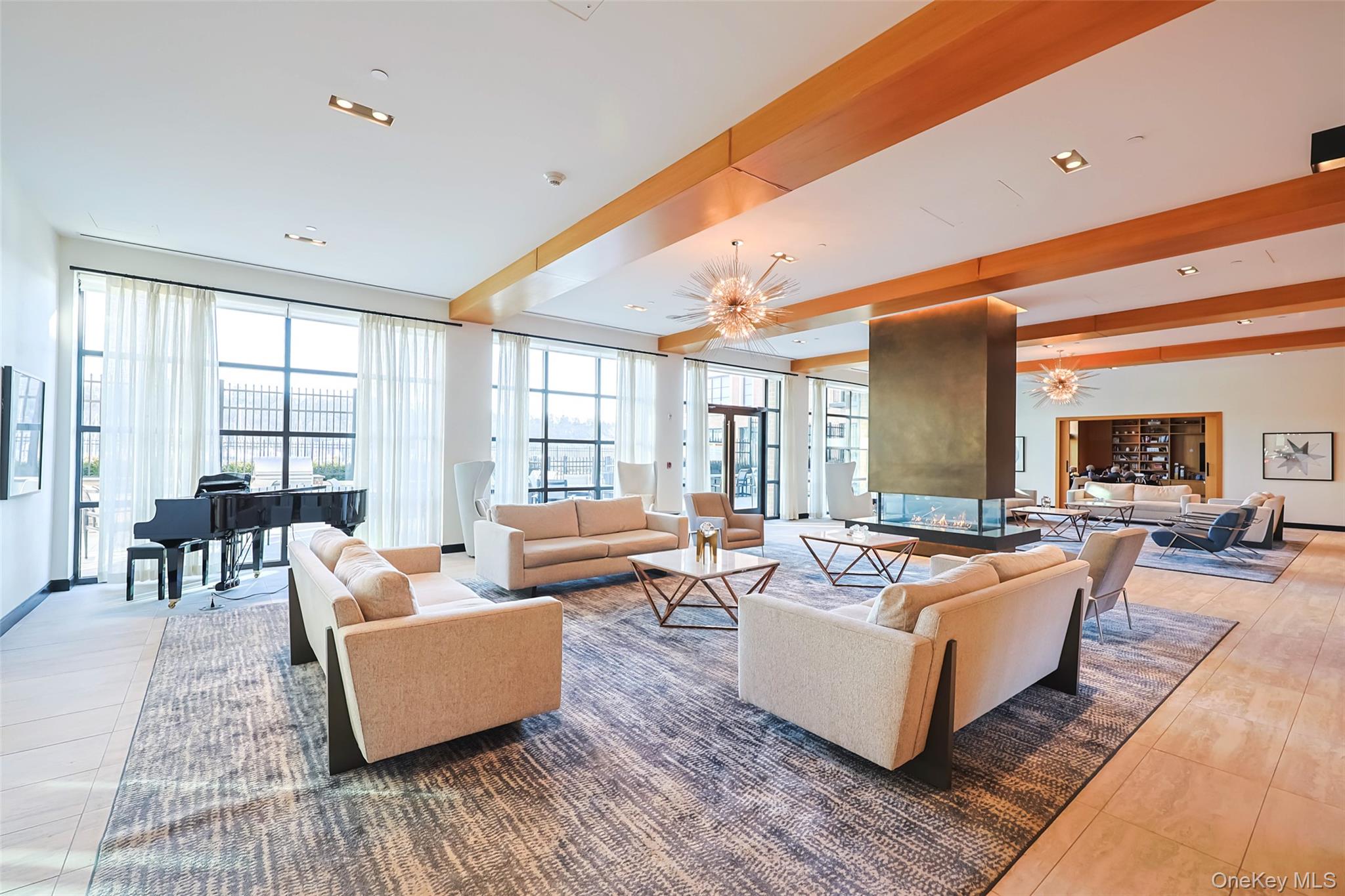 100 Garvies Point Road, Unit 1024 Glen Cove, NY 11542 - Photo 10 of 41 a living room with furniture and a large window