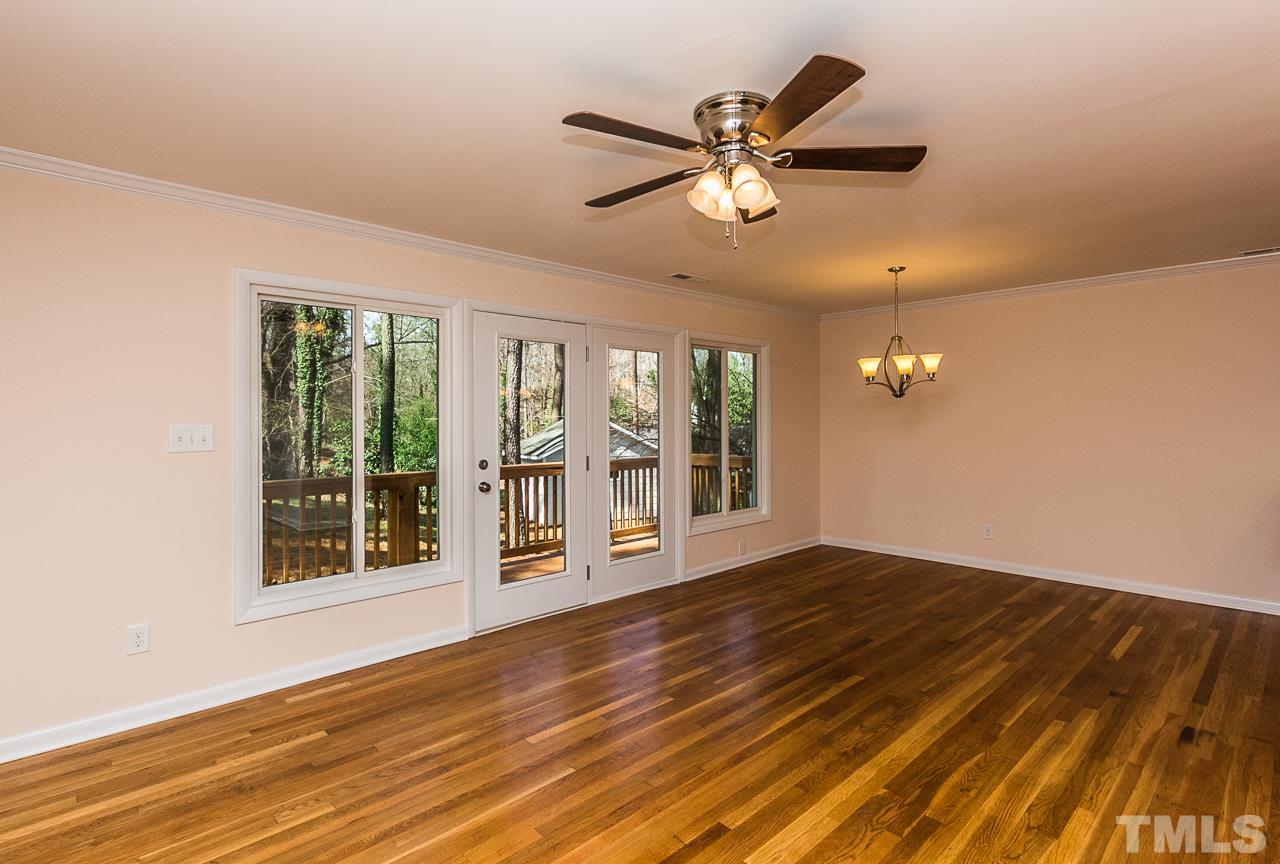1237 Somerset Road Raleigh, NC 27610 - Photo 17 of 25 a view of an empty room with wooden floor and a window