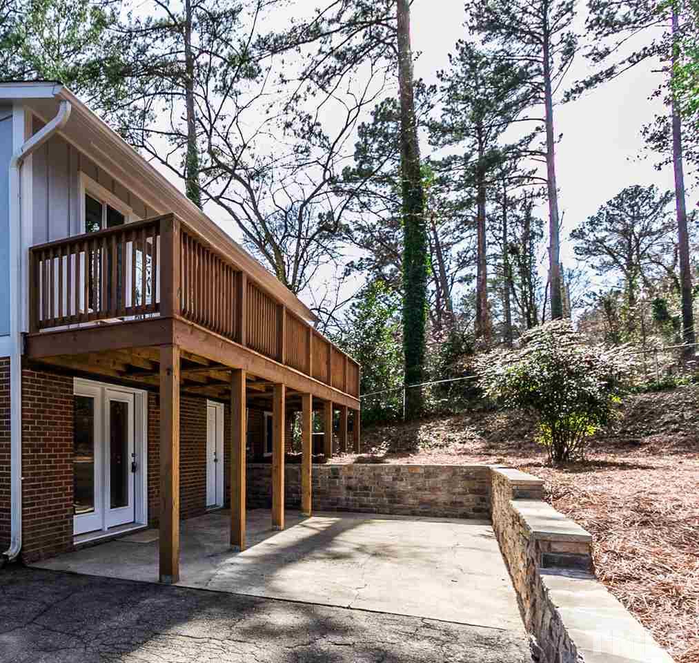 1237 Somerset Road Raleigh, NC 27610 - Photo 20 of 25 a view of a house with a yard and large tree