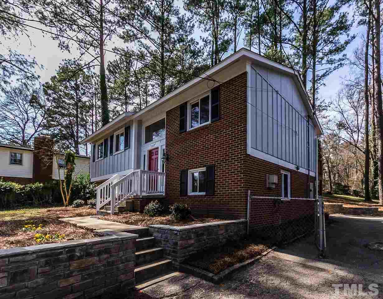 1237 Somerset Road Raleigh, NC 27610 - Photo 3 of 25 a front view of a house with yard
