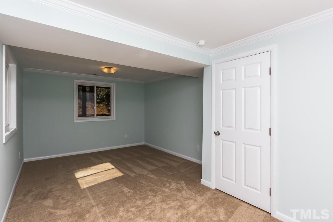1237 Somerset Road Raleigh, NC 27610 - Photo 6 of 25 an empty room with a workbench