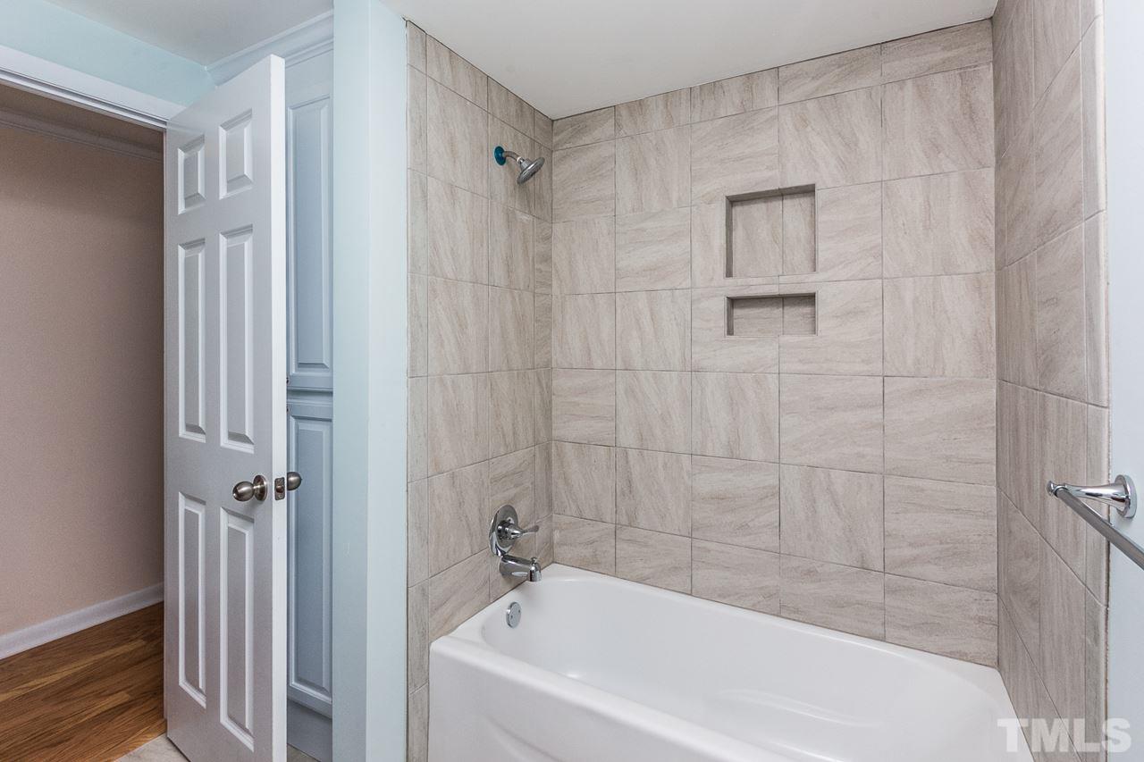 1237 Somerset Road Raleigh, NC 27610 - Photo 9 of 25 a bathroom with a bathtub