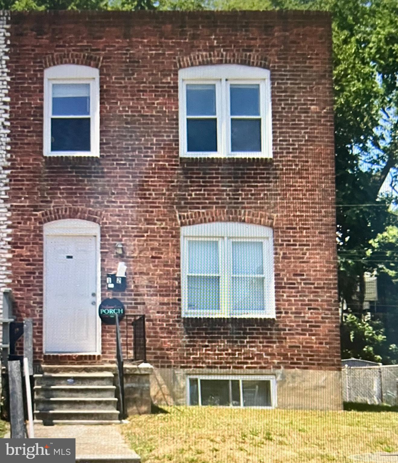 4132 Audrey Avenue Baltimore, MD 21225 - Photo 1 of 14 a building view with a brick wall