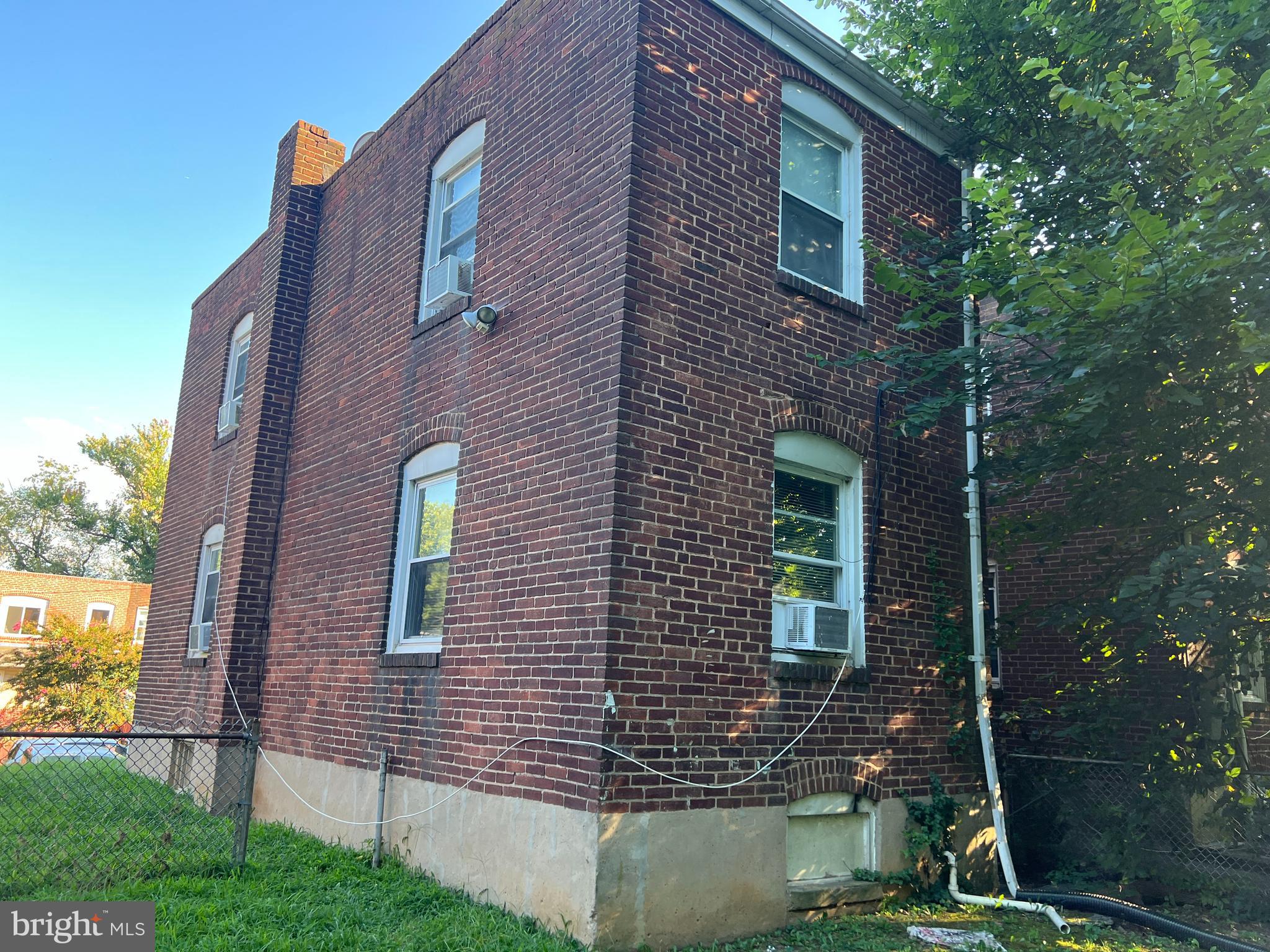 4132 Audrey Avenue Baltimore, MD 21225 - Photo 11 of 14 a view of a brick house with a yard
