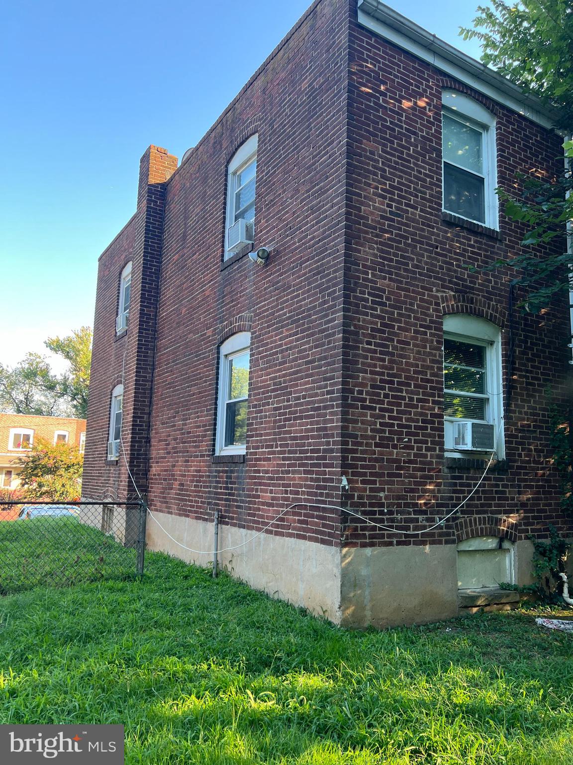4132 Audrey Avenue Baltimore, MD 21225 - Photo 12 of 14 a brick building with a yard