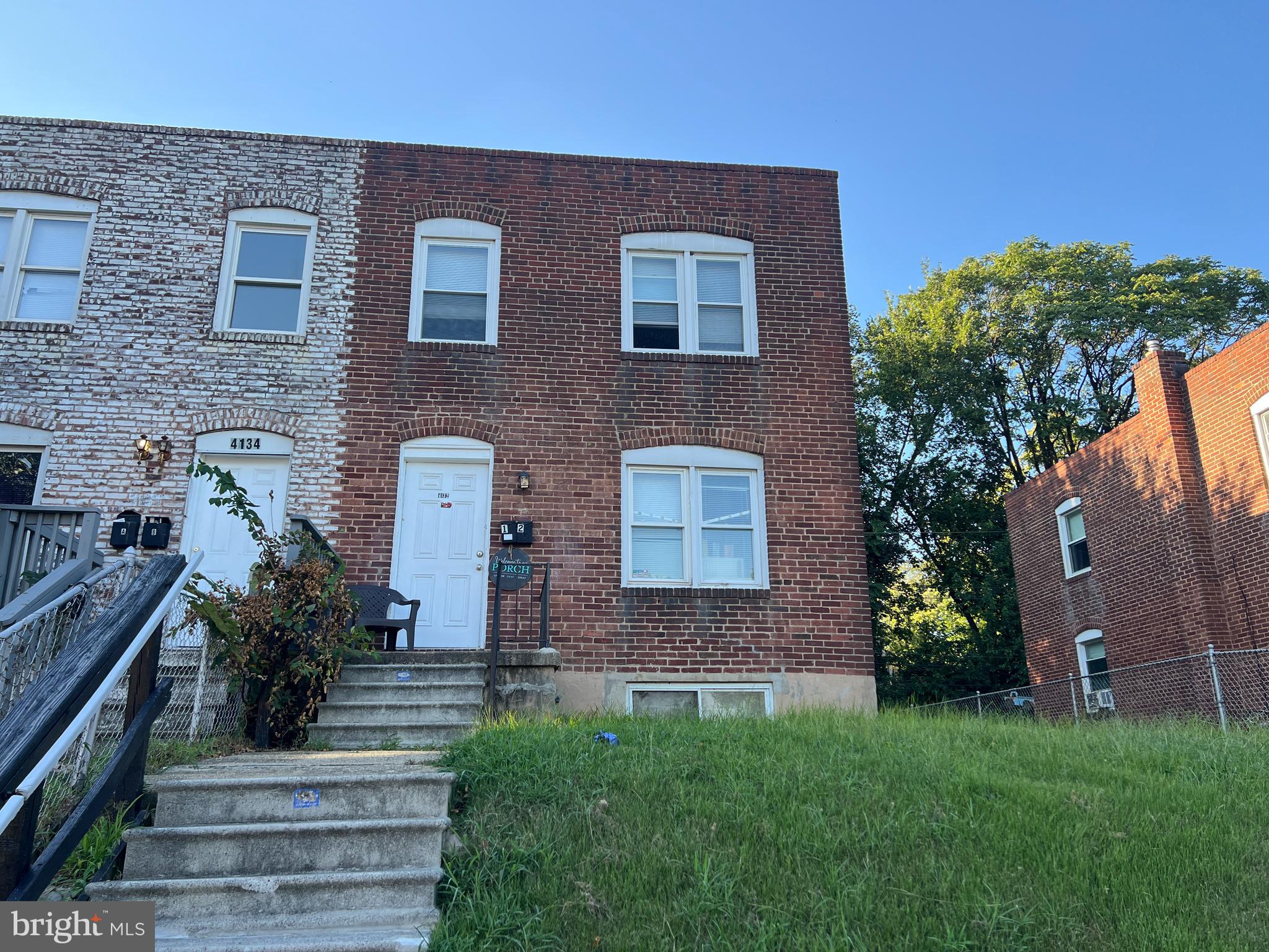 4132 Audrey Avenue Baltimore, MD 21225 - Photo 2 of 14 a front view of a house with garden