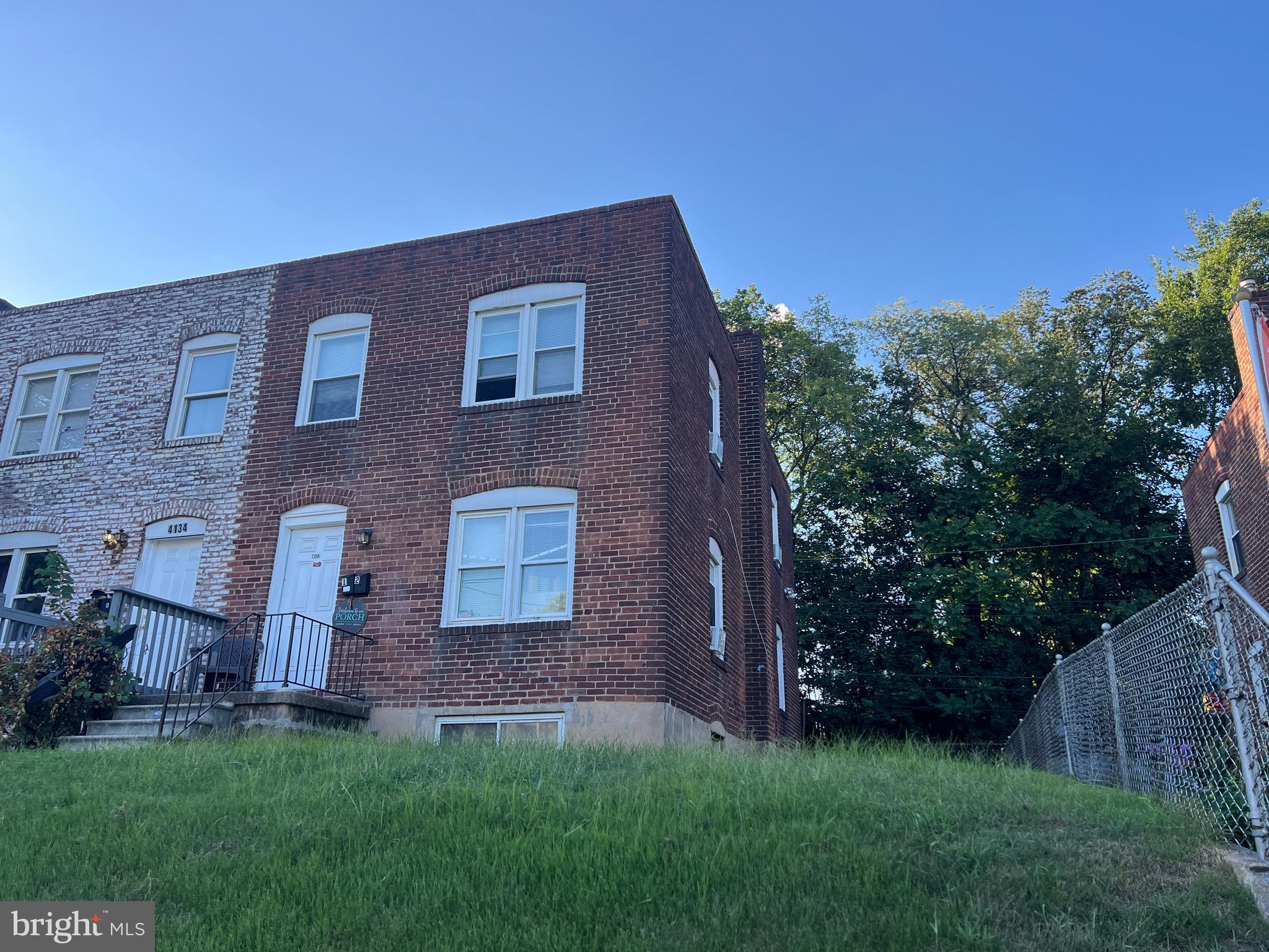 4132 Audrey Avenue Baltimore, MD 21225 - Photo 3 of 14 front view of house with a yard