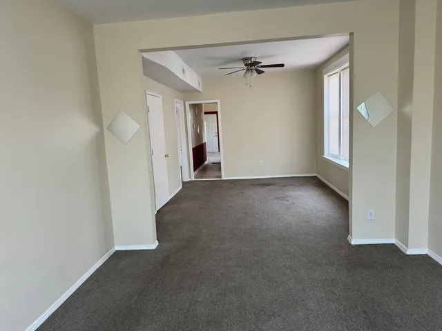 a view of an empty room with a window