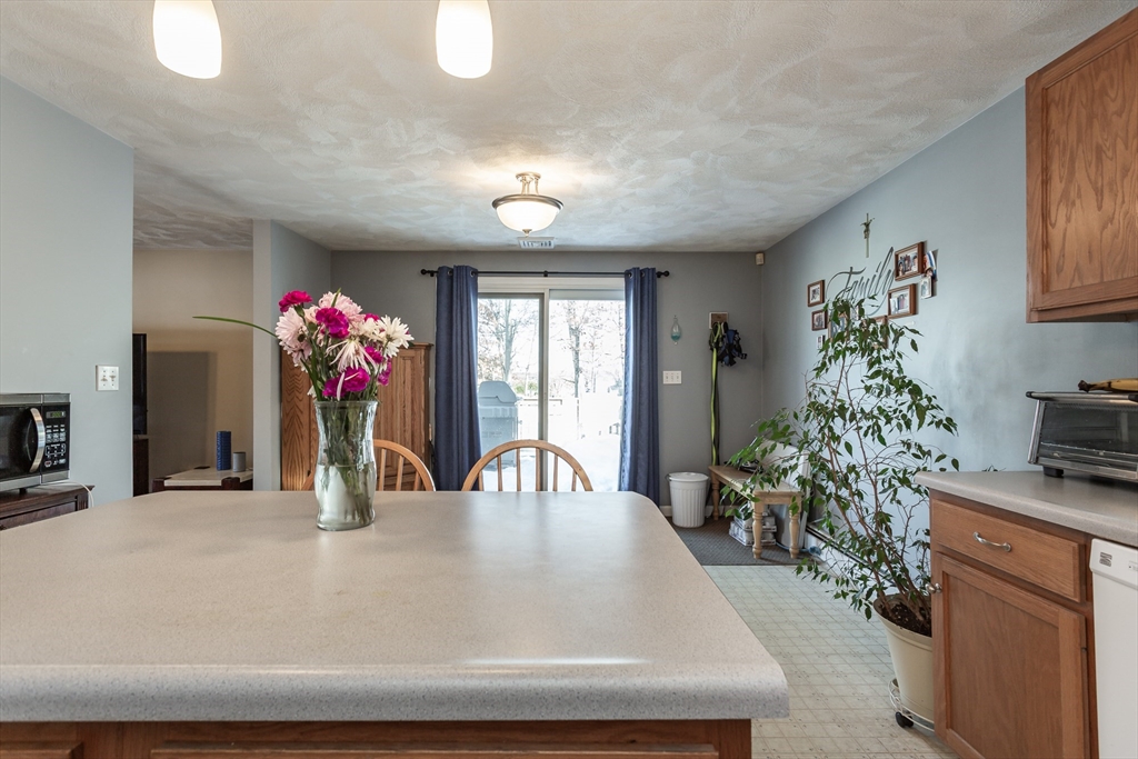95 Hiatt Street Fall River, MA 02721 - Photo 11 of 22 a dining room with furniture and flowers