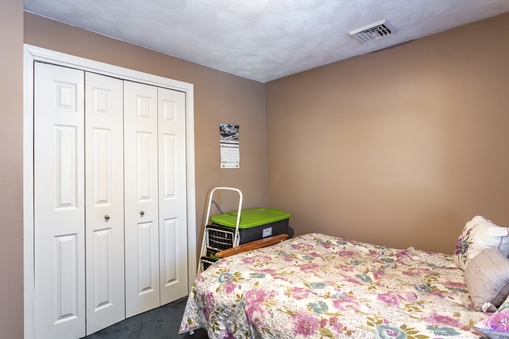 95 Hiatt Street Fall River, MA 02721 - Photo 13 of 22 a bedroom with a bed and a window