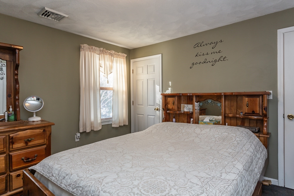 95 Hiatt Street Fall River, MA 02721 - Photo 15 of 22 a bedroom with a bed and a dresser