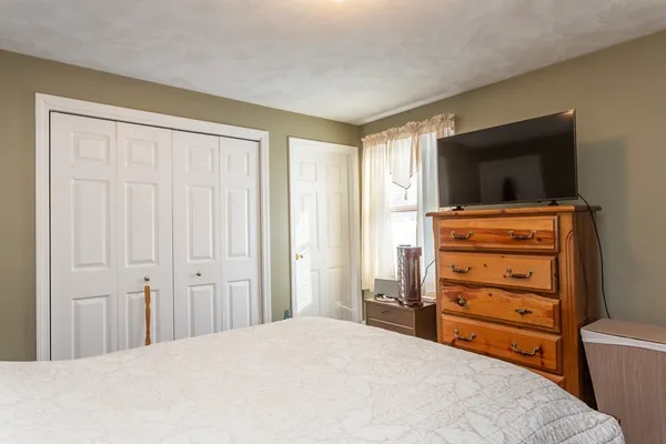 a room with a bed and a television in it