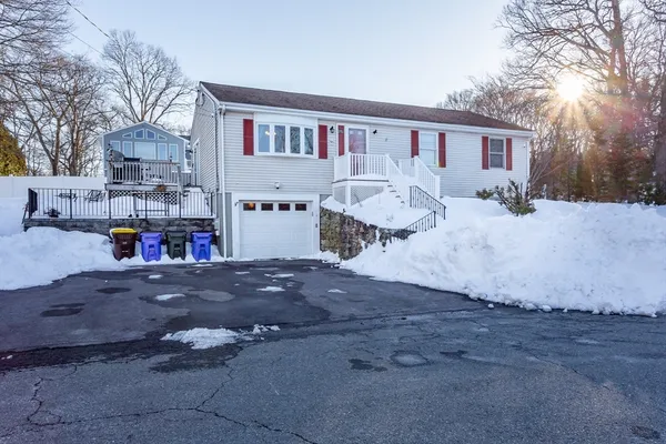 a backyard of a house with barbeque oven and outdoor seating