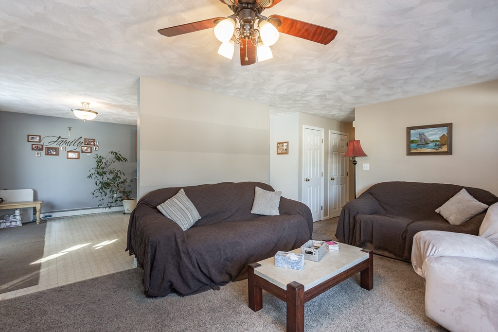 95 Hiatt Street Fall River, MA 02721 - Photo 5 of 22 a living room with furniture and a couch