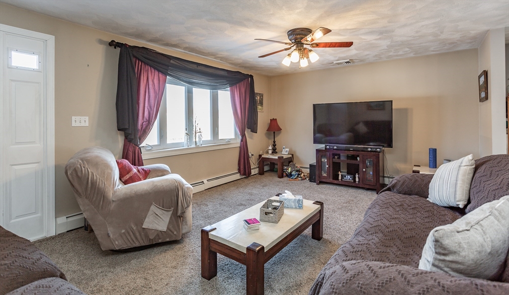 95 Hiatt Street Fall River, MA 02721 - Photo 6 of 22 a living room with furniture a flat screen tv and a window