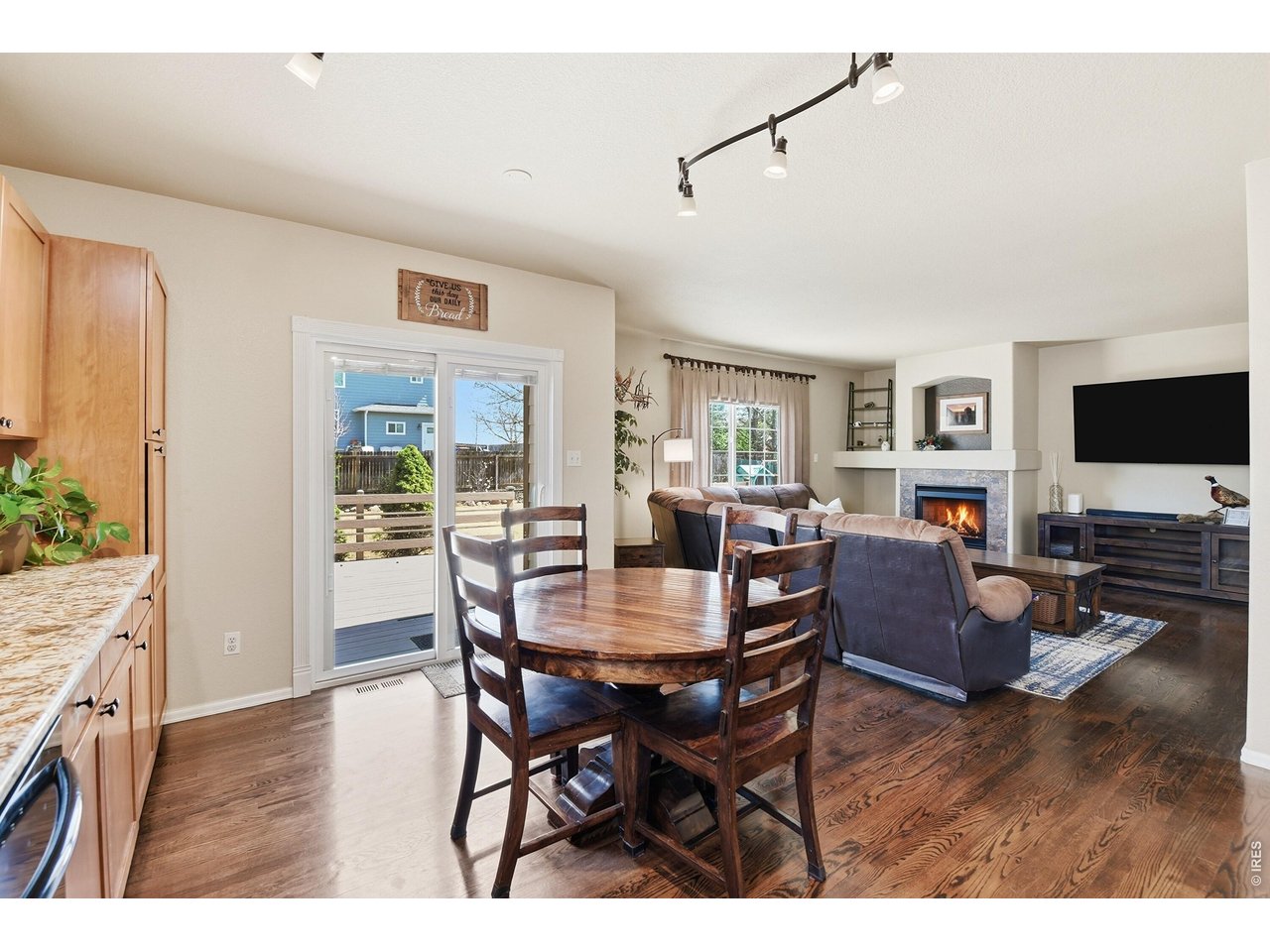 6291 Taylor Street Frederick, CO 80530 - Photo 12 of 50 a view of a dining room with furniture window and wooden floor