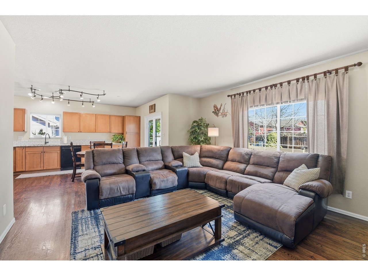6291 Taylor Street Frederick, CO 80530 - Photo 13 of 50 a living room with furniture and a large window