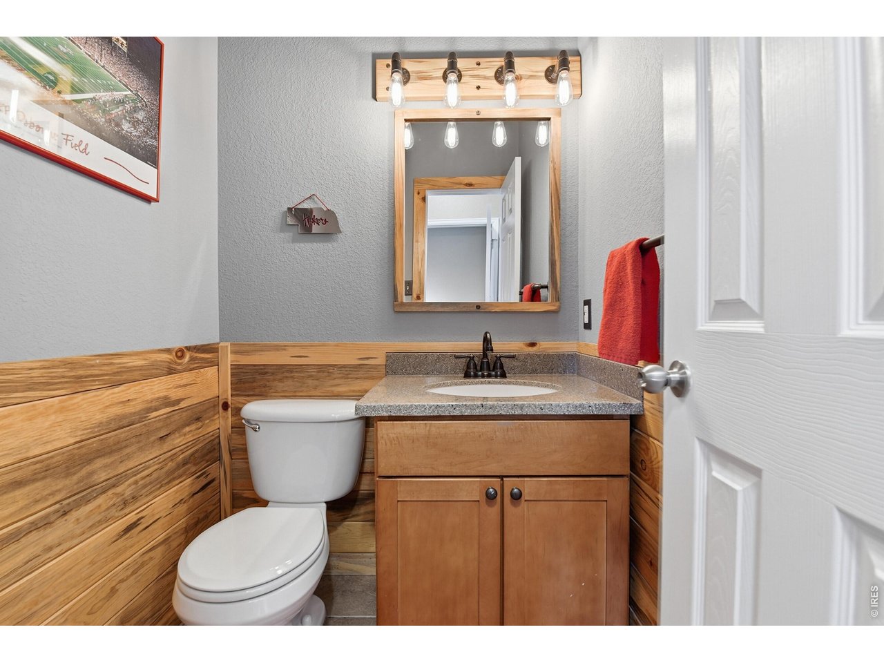 6291 Taylor Street Frederick, CO 80530 - Photo 15 of 50 a bathroom with a granite countertop toilet sink and mirror
