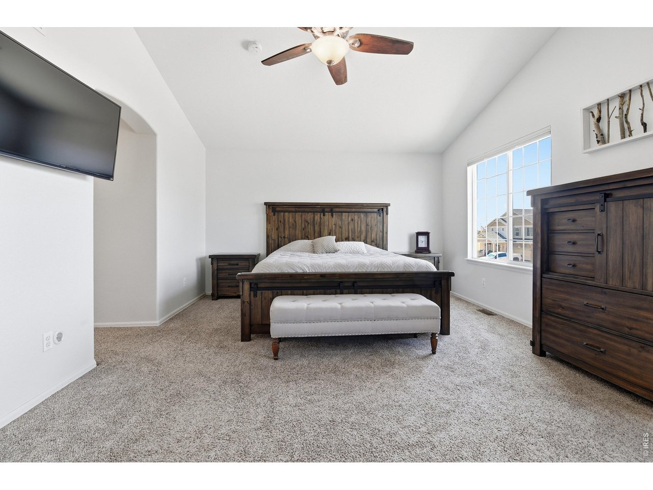 6291 Taylor Street Frederick, CO 80530 - Photo 17 of 50 a bedroom with furniture and a flat screen tv